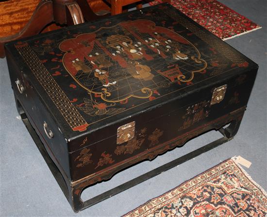 A Chinese black lacquered table box, on stand, W.92cm